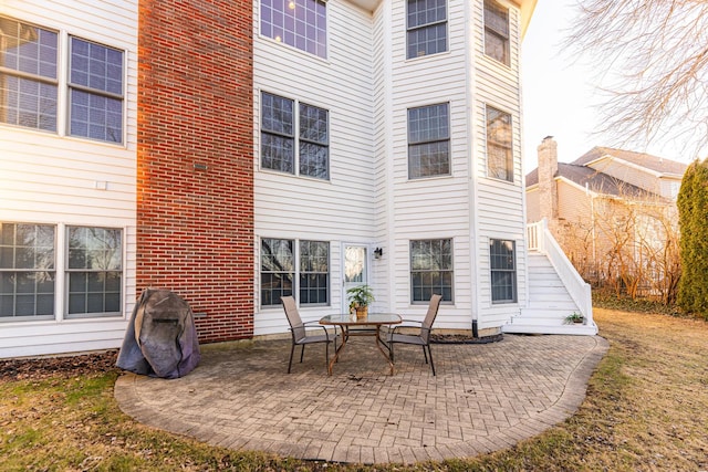 back of property featuring a patio area