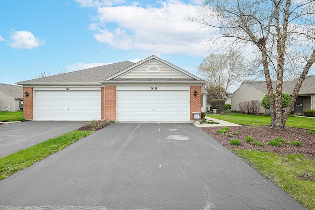 108 W Essington Dr Unit 108, Round Lake, IL 60073 - single story home featuring brick siding, a garage, a front yard, and aphalt driveway