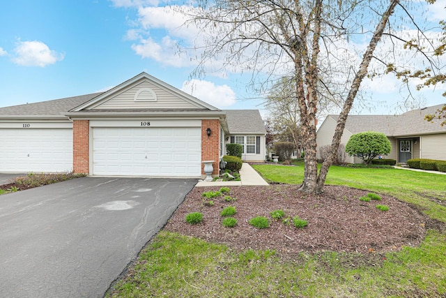108 W Essington Dr Unit 108, Round Lake, IL 60073 - single story home with brick siding, a garage, a front lawn, and driveway