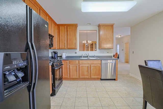 108 W Essington Dr Unit 108, Round Lake, IL 60073 - kitchen featuring an inviting chandelier, dark countertops, a sink, light tile patterned floors, and black appliances