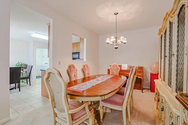 108 W Essington Dr Unit 108, Round Lake, IL 60073 - dining space with light tile patterned floors and a chandelier