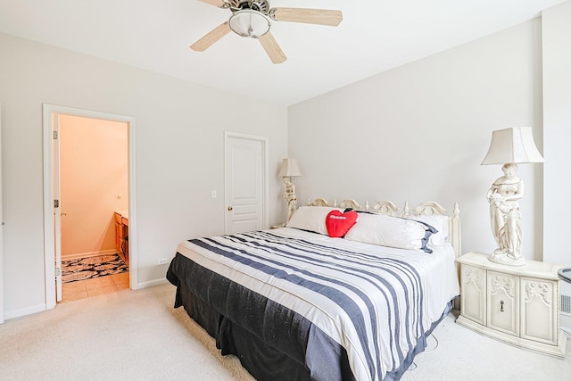 108 W Essington Dr Unit 108, Round Lake, IL 60073 - bedroom with baseboards, light carpet, ceiling fan, and ensuite bath