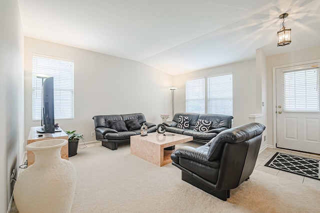 108 W Essington Dr Unit 108, Round Lake, IL 60073 - carpeted living room with baseboards and lofted ceiling