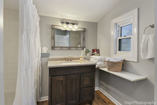 95 Hillside Ct, Fox Lake, IL 60020 - full bathroom with wood finished floors, vanity, a notable chandelier, and shower / bath combo with shower curtain