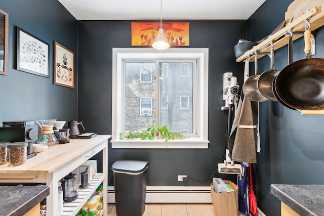office featuring baseboard heating, a baseboard radiator, and light tile patterned flooring