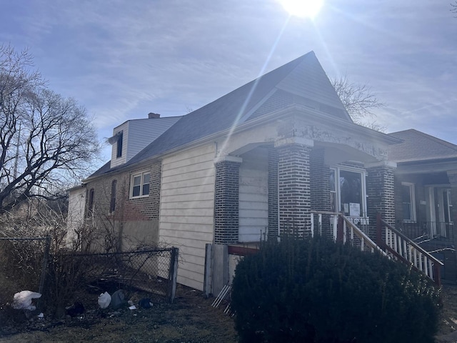 view of home's exterior with brick siding