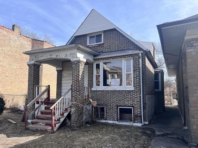 view of front of property featuring brick siding