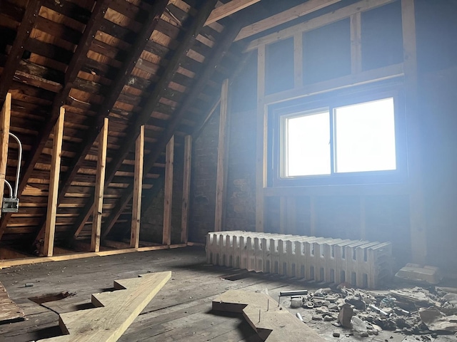 unfinished attic with radiator