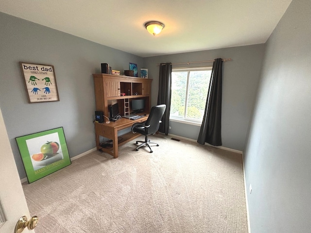 office area with visible vents, carpet flooring, and baseboards