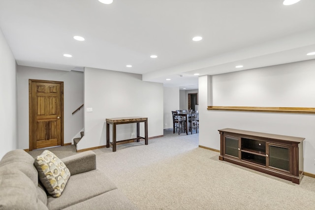 living room with recessed lighting, baseboards, and carpet floors