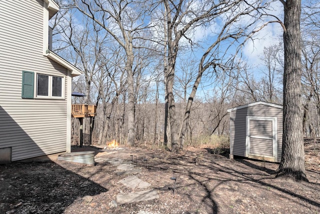 view of yard with an outbuilding and a storage unit