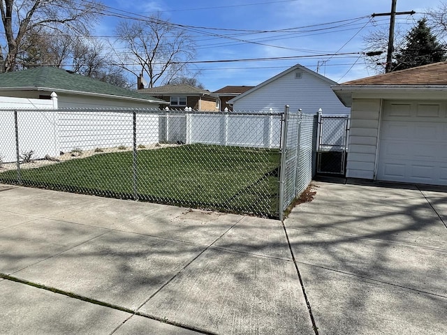 exterior space featuring a gate, fence, and a lawn