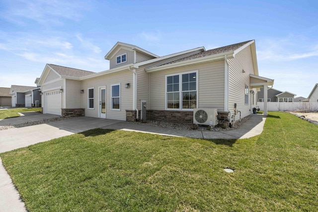 6367 Jasmine Ave, Portage, IN 46368 - view of front facade with stone siding, an attached garage, fence, ac unit, and a front yard
