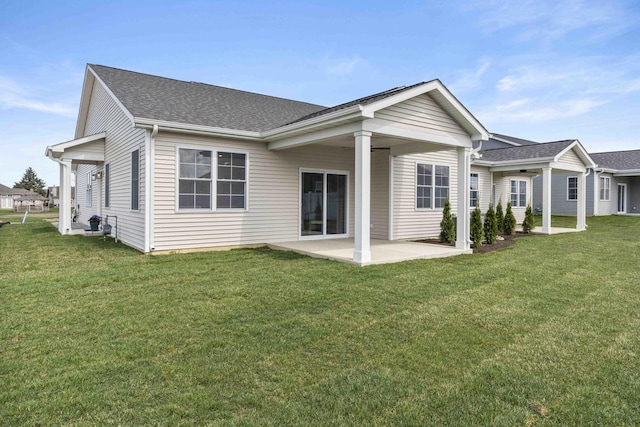 6367 Jasmine Ave, Portage, IN 46368 - rear view of house with a lawn, roof with shingles, and a patio