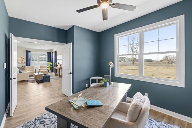 6367 Jasmine Ave, Portage, IN 46368 - dining area with wood finished floors, a ceiling fan, and baseboards