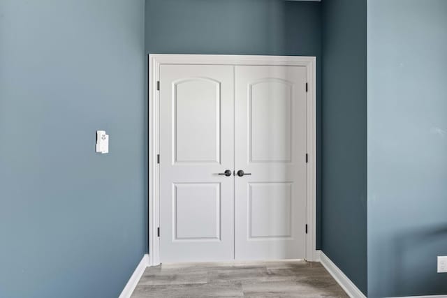 6367 Jasmine Ave, Portage, IN 46368 - unfurnished bedroom featuring baseboards, wood finished floors, and a closet