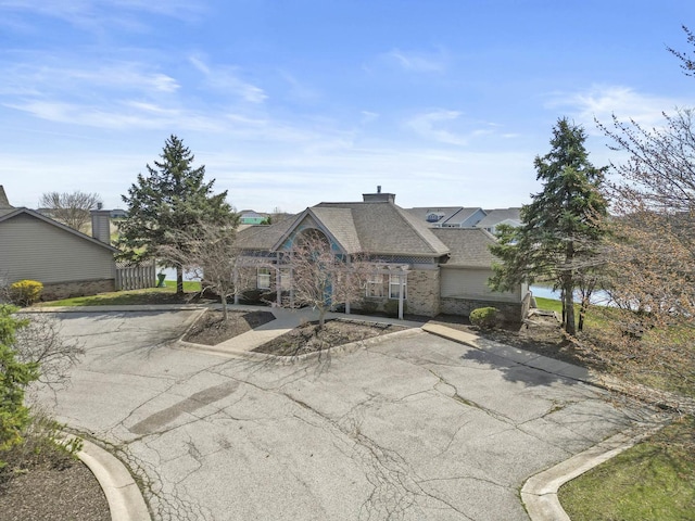 6367 Jasmine Ave, Portage, IN 46368 - view of front facade featuring brick siding and roof with shingles