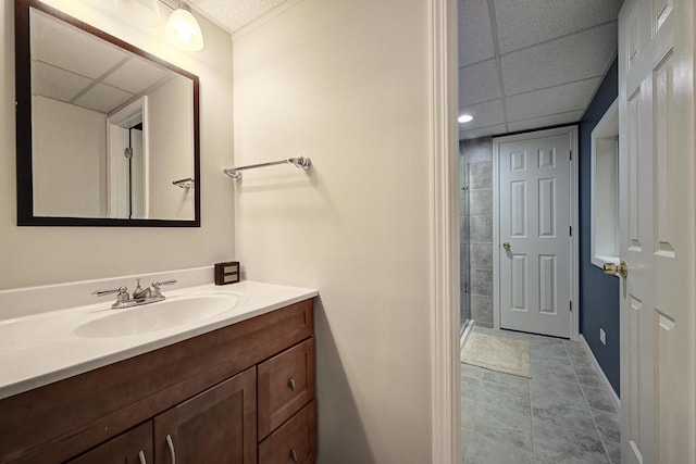 2136 Yale Cir, Hoffman Estates, IL 60192 - full bath featuring a tile shower, a paneled ceiling, vanity, and baseboards