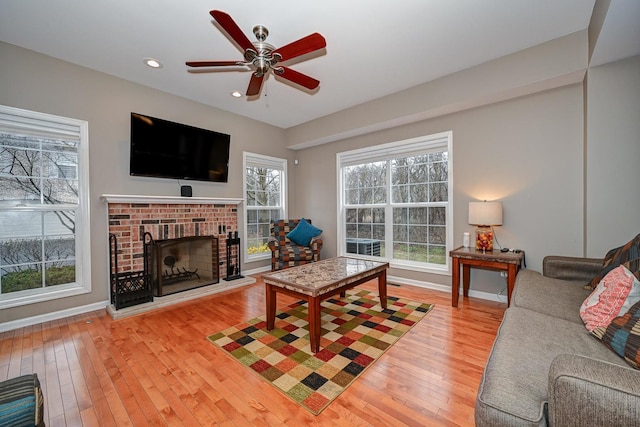 2136 Yale Cir, Hoffman Estates, IL 60192 - living room featuring baseboards, a brick fireplace, ceiling fan, hardwood / wood-style flooring, and recessed lighting