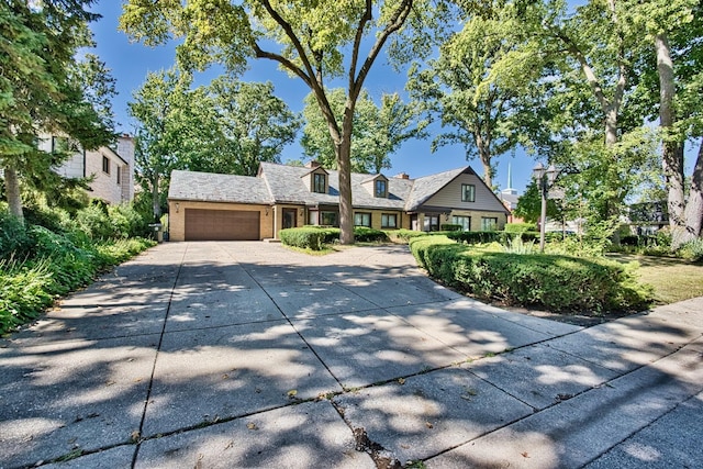 6776 N Laporte Ave, Lincolnwood, IL 60712 - view of front facade with an attached garage, concrete driveway, and brick siding