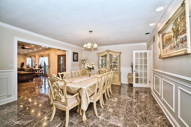 6776 N Laporte Ave, Lincolnwood, IL 60712 - dining space with a decorative wall, a wainscoted wall, ornamental molding, a chandelier, and dark marble finish flooring