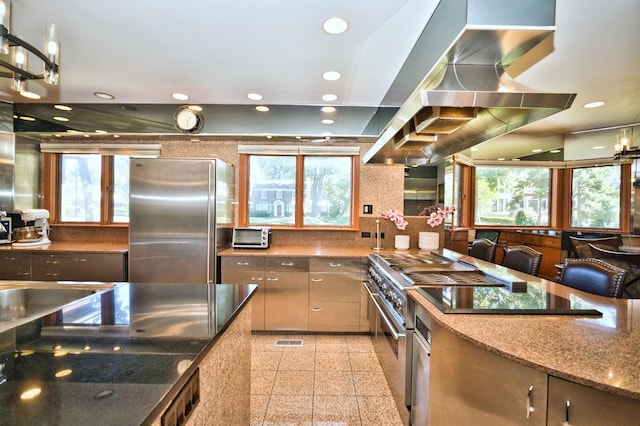 6776 N Laporte Ave, Lincolnwood, IL 60712 - kitchen with appliances with stainless steel finishes, granite tiled floors, stone counters, wall chimney exhaust hood, and recessed lighting
