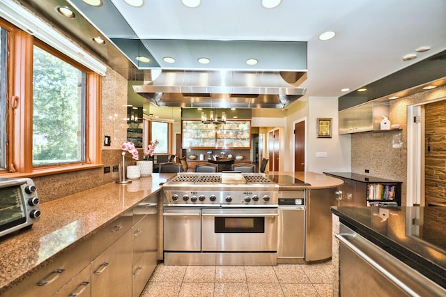 6776 N Laporte Ave, Lincolnwood, IL 60712 - kitchen featuring stainless steel appliances, granite tiled floors, backsplash, plenty of natural light, and recessed lighting