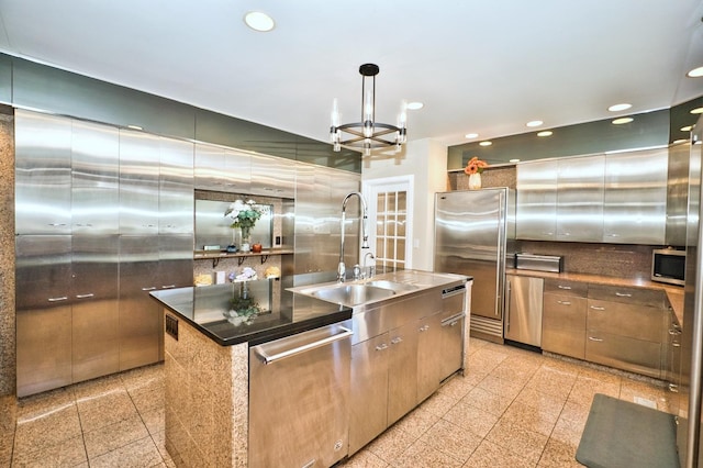 6776 N Laporte Ave, Lincolnwood, IL 60712 - kitchen featuring appliances with stainless steel finishes, recessed lighting, granite tiled floors, an island with sink, and tasteful backsplash