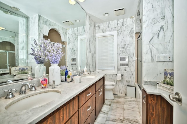 6776 N Laporte Ave, Lincolnwood, IL 60712 - bathroom featuring double vanity, a shower with door, tile walls, and marble finish floors