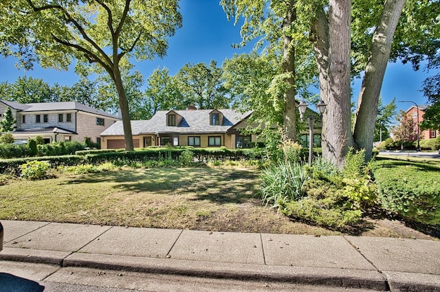 6776 N Laporte Ave, Lincolnwood, IL 60712 - view of front of home featuring a front yard and a chimney