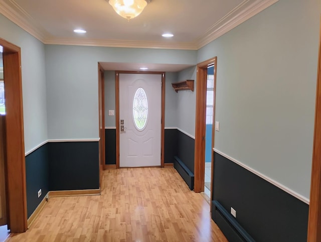 foyer entrance featuring crown molding, light wood finished floors, baseboards, and recessed lighting