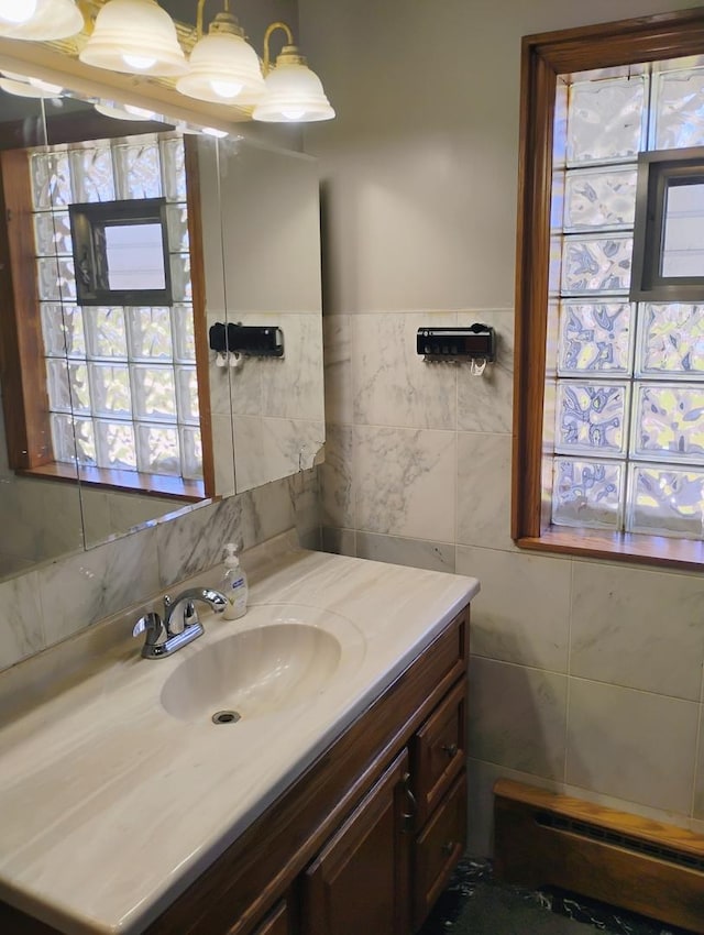 bathroom with tile walls and vanity