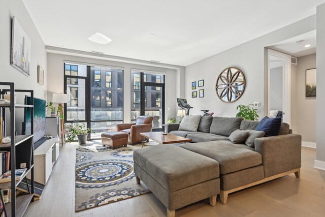 1701 W Webster Ave Unit 512, Chicago, IL 60614 - living area with visible vents, baseboards, and wood finished floors
