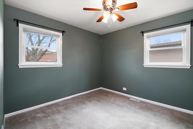 610 E Lemoyne Ave, Lombard, IL 60148 - carpeted empty room featuring visible vents, baseboards, ceiling fan, and a healthy amount of sunlight