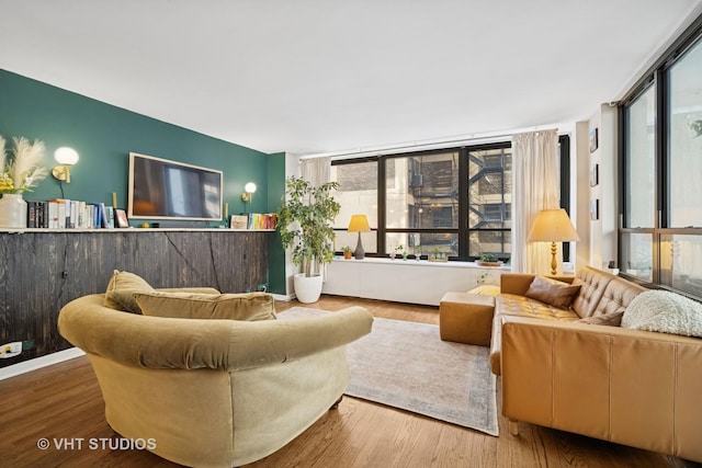 222 E Pearson St Unit 409, Chicago, IL 60611 - living room featuring wood finished floors and a wealth of natural light