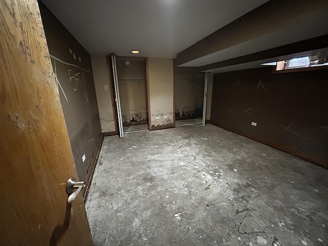 unfurnished bedroom with two closets