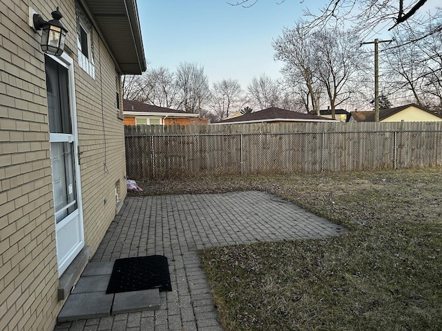 view of yard featuring a patio area and fence