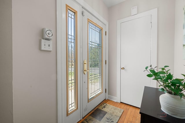 foyer with light wood-style floors