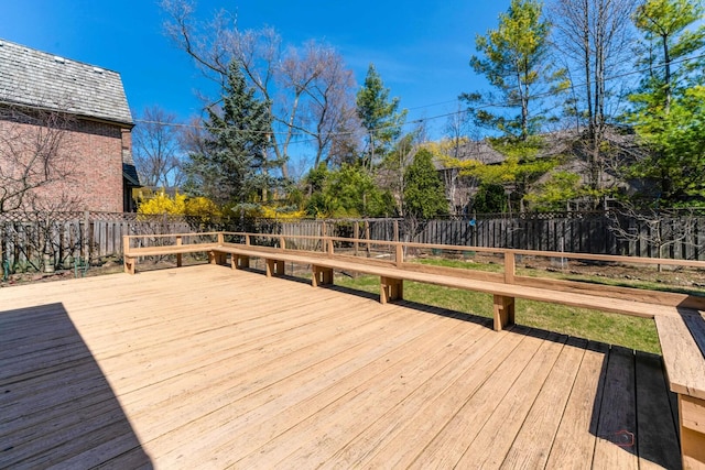 deck with a fenced backyard