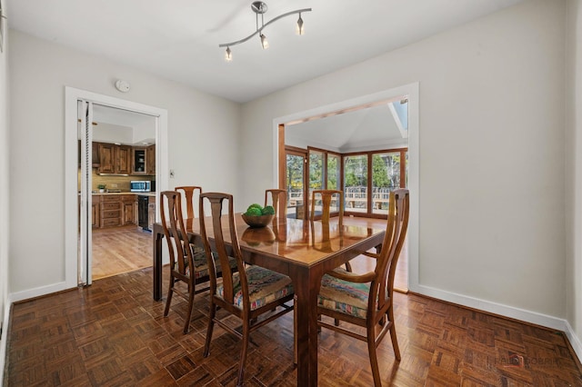 dining space featuring baseboards