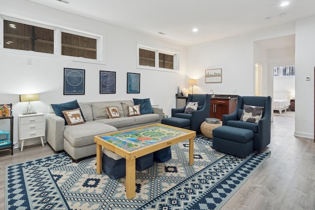 living area featuring recessed lighting and wood finished floors
