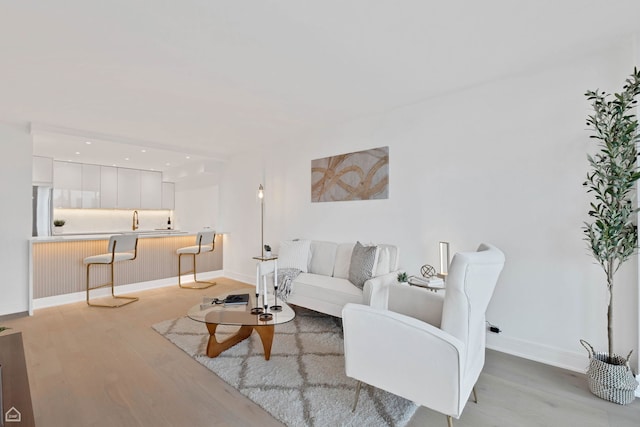 1560 N Sandburg Ter Unit 1011J, Chicago, IL 60610 - living room with light wood-style floors and baseboards