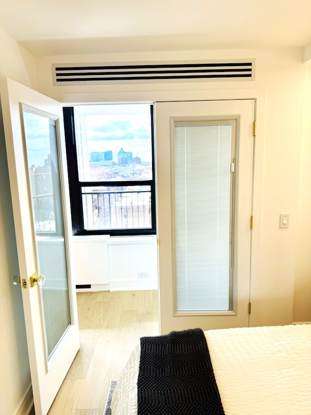 1560 N Sandburg Ter Unit 1011J, Chicago, IL 60610 - bedroom with wood finished floors