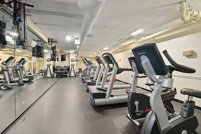 1560 N Sandburg Ter Unit 1011J, Chicago, IL 60610 - gym with a textured ceiling