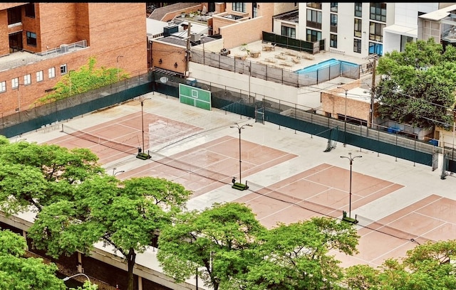 1560 N Sandburg Ter Unit 1011J, Chicago, IL 60610 - view of tennis court featuring fence