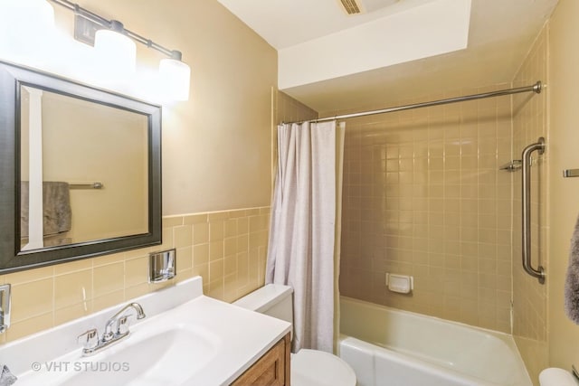 110 S Dunton Ave Unit 2A, Arlington Heights, IL 60005 - bathroom with vanity, shower / tub combo, tile walls, and a wainscoted wall