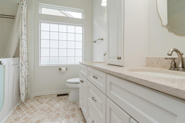 1177 Heathrow Ln, Aurora, IL 60502 - bathroom featuring double vanity, plenty of natural light, tile patterned flooring, and a shower with curtain