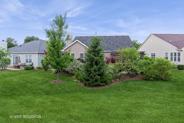 1177 Heathrow Ln, Aurora, IL 60502 - back of house with a yard, a patio area, a chimney, and a shingled roof