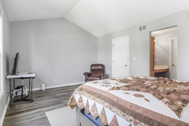 bedroom featuring visible vents, baseboards, wood finished floors, and lofted ceiling