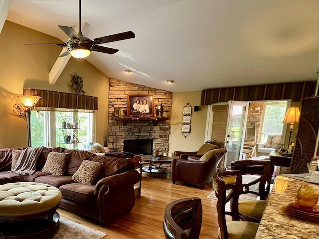 38W715 Bonnie Ct, Saint Charles, IL 60175 - living area with light wood-style flooring, a stone fireplace, vaulted ceiling, and ceiling fan
